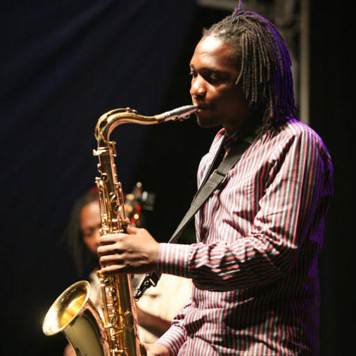 Juma Tutu playing saxophone during a live performance